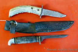 Knife with antler handle, 7" long; well used knife in leather sheaf.