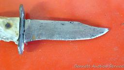 Knife with antler handle, 7" long; well used knife in leather sheaf.