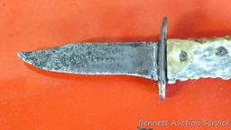 Knife with antler handle, 7" long; well used knife in leather sheaf.