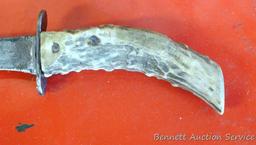 Knife with antler handle, 7" long; well used knife in leather sheaf.