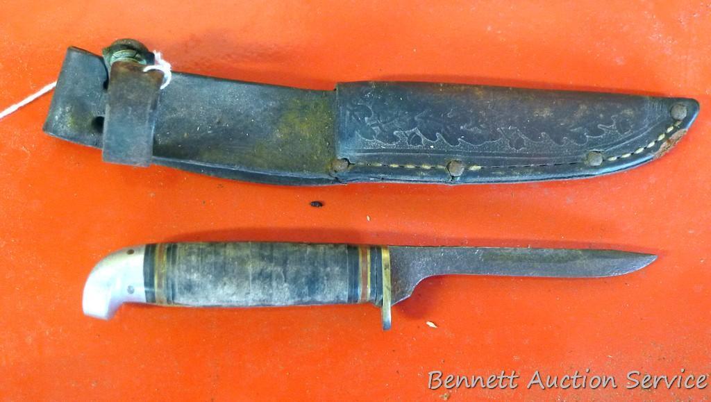 Knife with antler handle, 7" long; well used knife in leather sheaf.