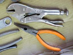 Assortment of wrenches including needle nose, vise grips, cutting, crescent and adjustable.