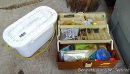 Plano tackle box filled with sinkers, bobbers and fishing lures and more.