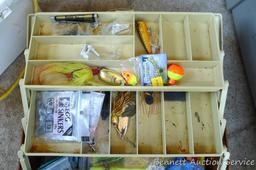 Plano tackle box filled with sinkers, bobbers and fishing lures and more.