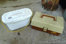Plano tackle box filled with sinkers, bobbers and fishing lures and more.