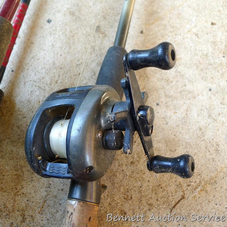 Three fishing rods with reels. One Fenwick rod 78" tall with a Quantam reel, one Quantam rod 74"