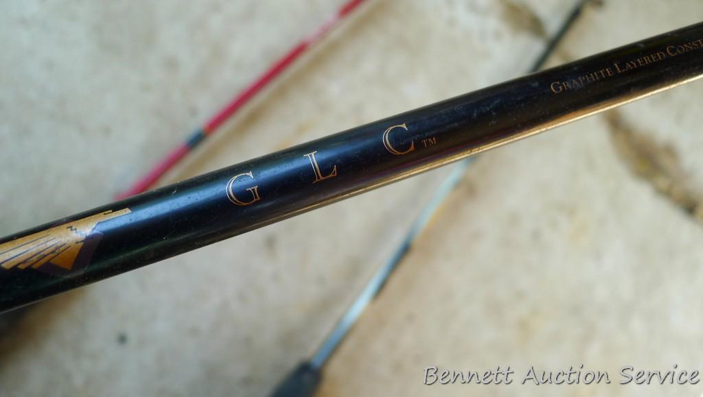Three fishing rods with reels. One Fenwick rod 78" tall with a Quantam reel, one Quantam rod 74"