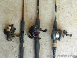 Three fishing rods with reels. One Fenwick rod 78" tall with a Quantam reel, one Quantam rod 74"