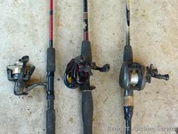 Three fishing rods with reels. One Fenwick rod 78" tall with a Quantam reel, one Quantam rod 74"