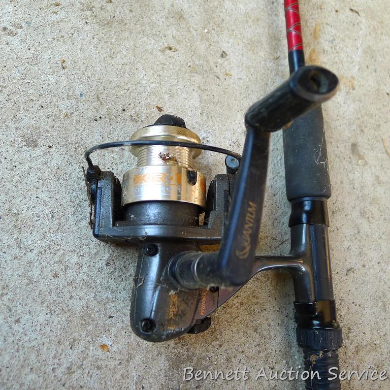 Three fishing rods with reels. One Fenwick rod 78" tall with a Quantam reel, one Quantam rod 74"