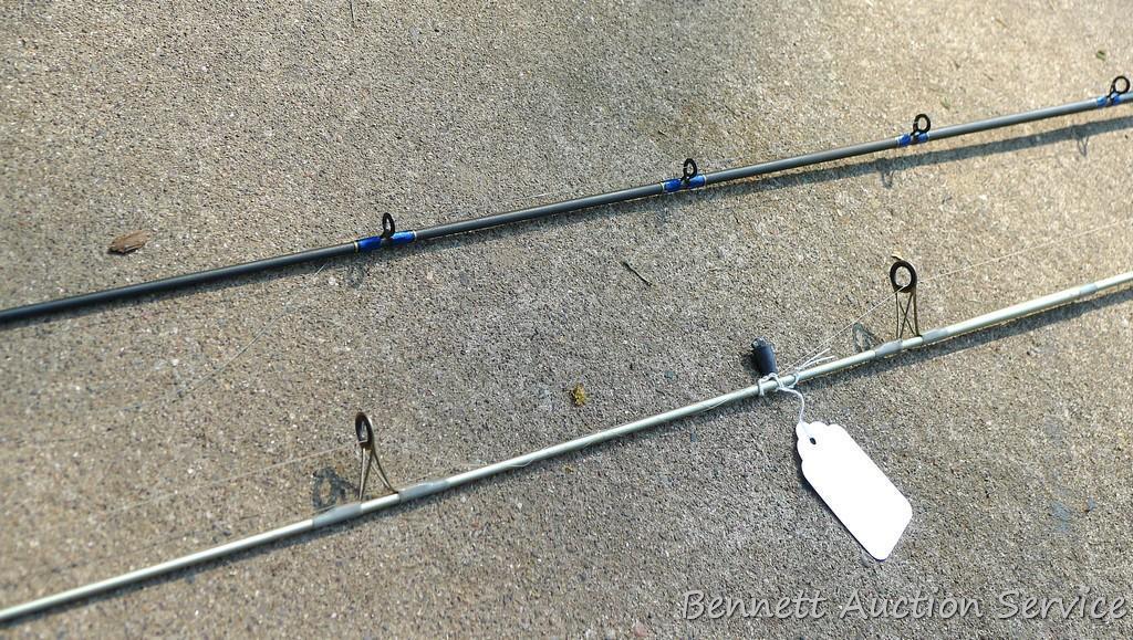 Two fishing rods with reels. One Cabela's Tourney Trail IM7 rod, one Mitchell graphite rod. One has