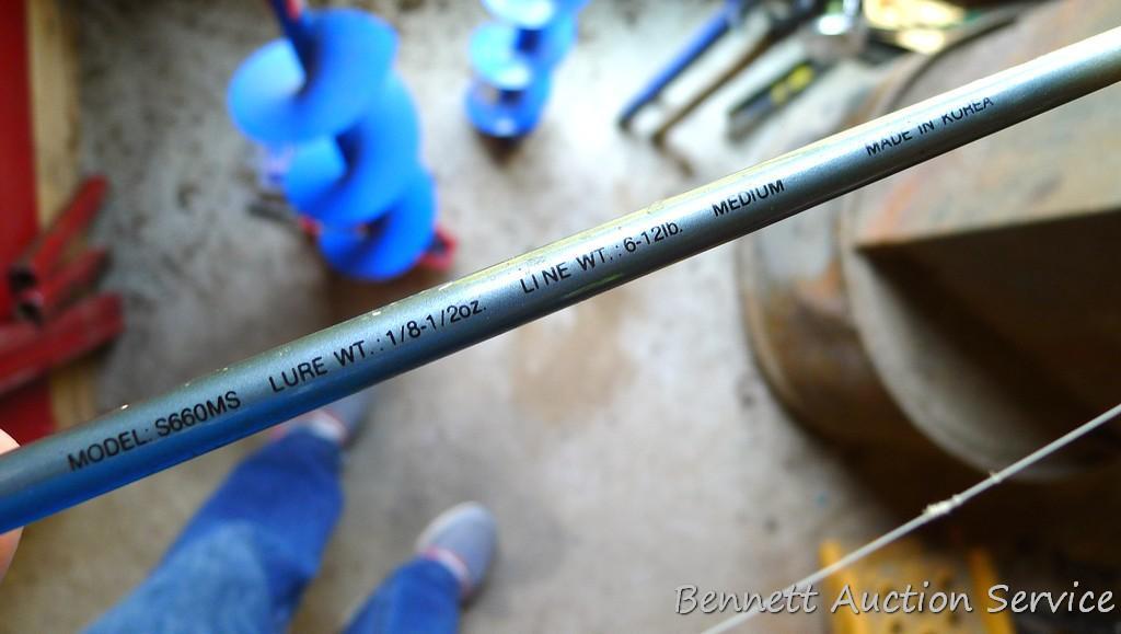 Two fishing rods with reels. One Cabela's Tourney Trail IM7 rod, one Mitchell graphite rod. One has