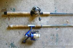 Two fishing rods with reels. One Cabela's Tourney Trail IM7 rod, one Mitchell graphite rod. One has