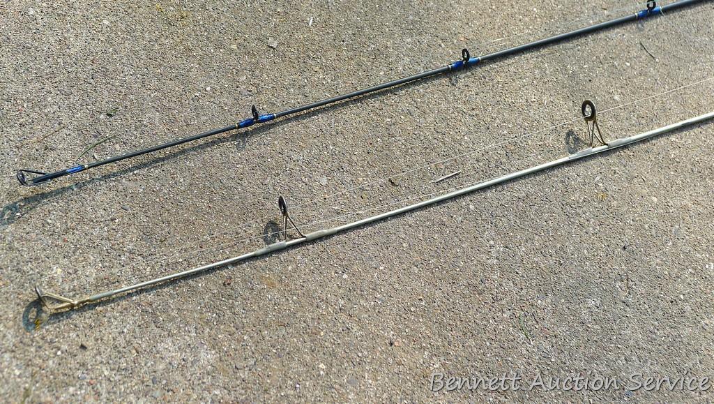 Two fishing rods with reels. One Cabela's Tourney Trail IM7 rod, one Mitchell graphite rod. One has
