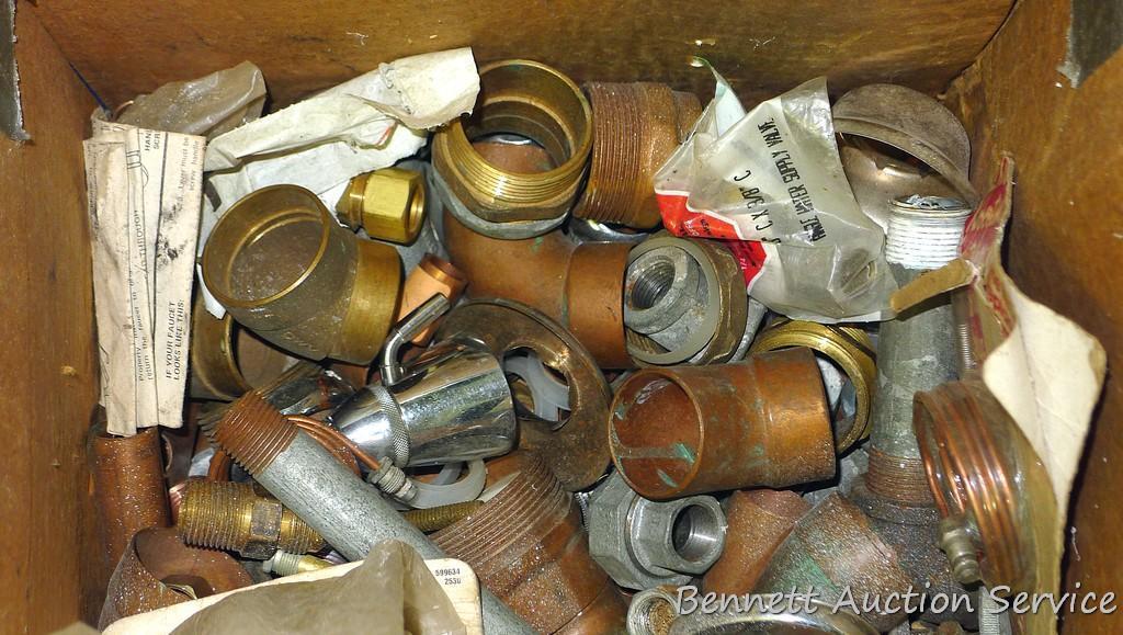 Partial crate full of plumbing fittings, includes nipples, copper and more.