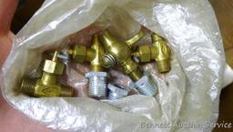 Partial crate full of plumbing fittings, includes nipples, copper and more.