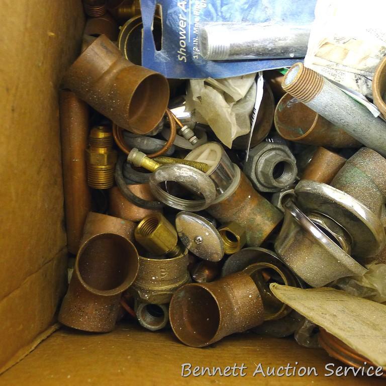 Partial crate full of plumbing fittings, includes nipples, copper and more.