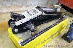 Sears hydraulic floor jack with handle. Lifts 3,300 lbs. Model #214.125100. Comes in plastic