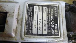 Sears hydraulic floor jack with handle. Lifts 3,300 lbs. Model #214.125100. Comes in plastic