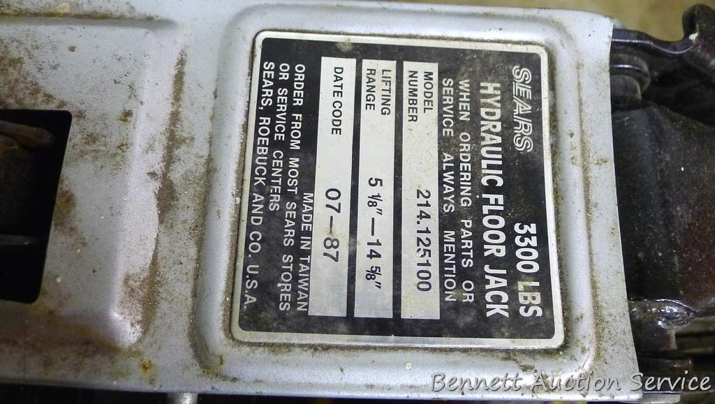 Sears hydraulic floor jack with handle. Lifts 3,300 lbs. Model #214.125100. Comes in plastic