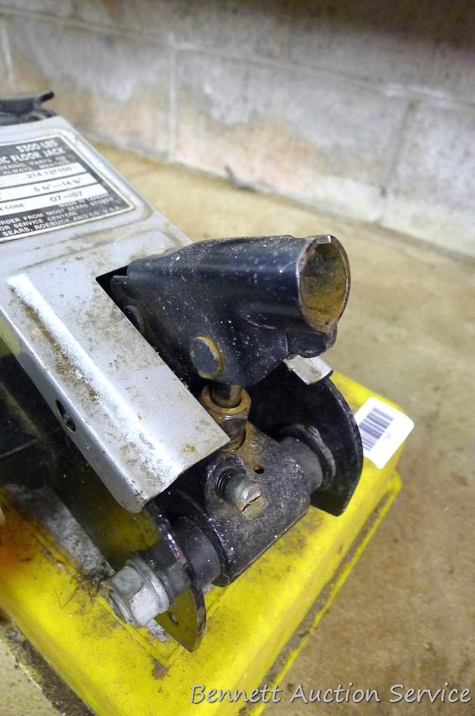 Sears hydraulic floor jack with handle. Lifts 3,300 lbs. Model #214.125100. Comes in plastic