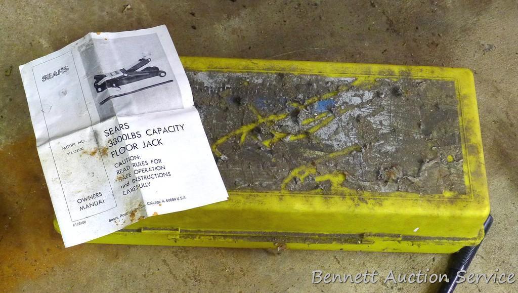Sears hydraulic floor jack with handle. Lifts 3,300 lbs. Model #214.125100. Comes in plastic