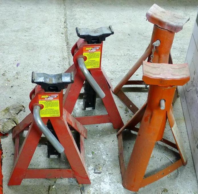 Two automotive 3 ton jack stands in good shape, stand 11" tall; 2 lighter duty jack stands.