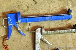 Pair of caulking guns for standard tubes; one gun for large tubes.