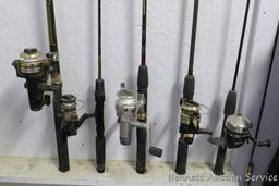 Five fishing rods with reels, tallest is 80" includes Cardinal with a graphite rod; St Croix; Zebco