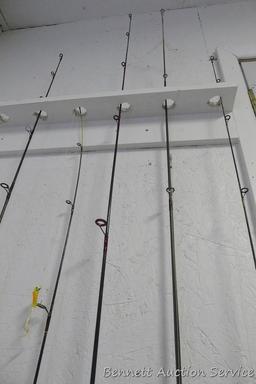 Five fishing rods with reels, tallest is 80" includes Cardinal with a graphite rod; St Croix; Zebco