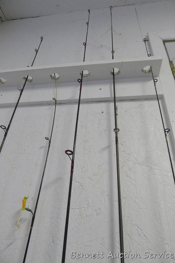 Five fishing rods with reels, tallest is 80" includes Cardinal with a graphite rod; St Croix; Zebco