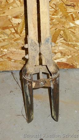 Craftsman No. 8330C post hole digger with measuring guide, stands approx. 5' tall.