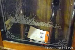 Wooden gun cabinet with two locking storage areas and etched glass door is approx. 29" x 11" x 72"