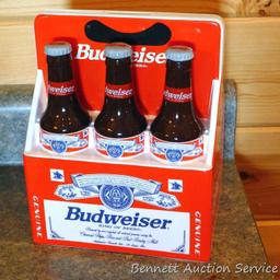 1998 Budweiser ceramic coin bank with some contents. Stands nearly 8" high.