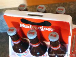 1998 Budweiser ceramic coin bank with some contents. Stands nearly 8" high.