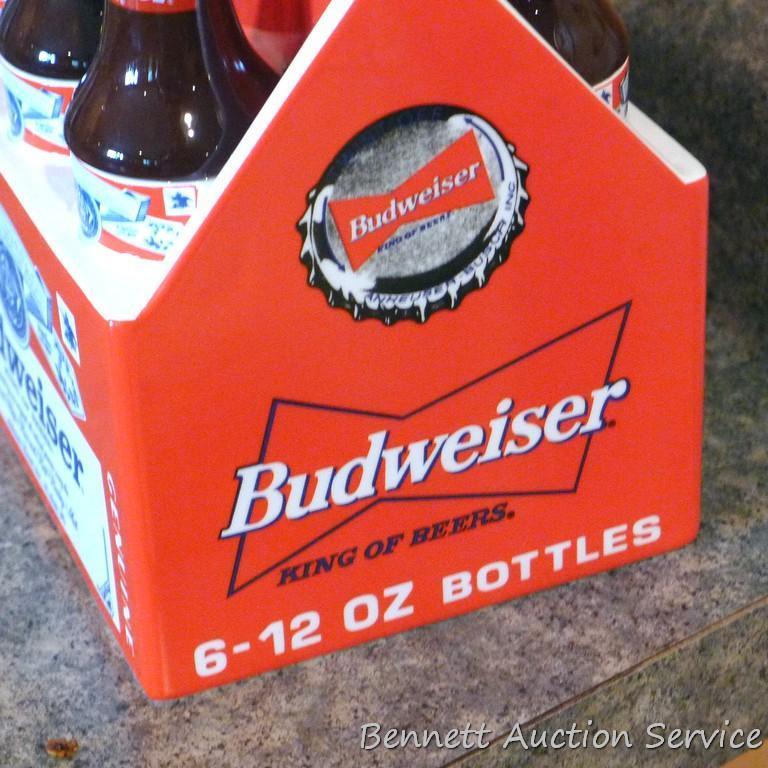 1998 Budweiser ceramic coin bank with some contents. Stands nearly 8" high.