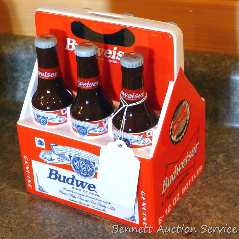 1998 Budweiser ceramic coin bank with some contents. Stands nearly 8" high.