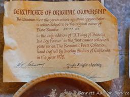 Two Incolay collector's plates with certificates of original ownership. One titled 'She Walks in
