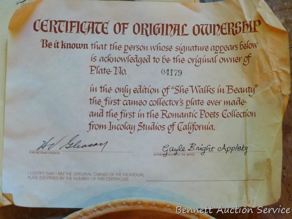 Two Incolay collector's plates with certificates of original ownership. One titled 'She Walks in