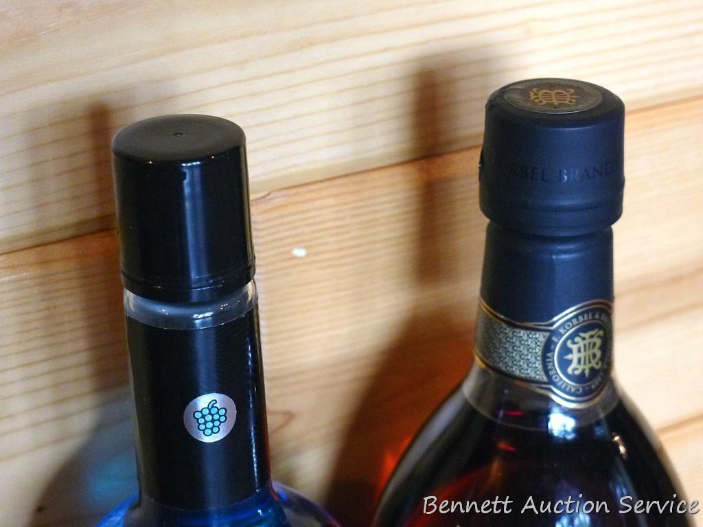 No shipping. Huge bottle Korbel brandy; liter bottle of UV Blue raspberry flavored vodka; small gift