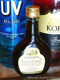 No shipping. Huge bottle Korbel brandy; liter bottle of UV Blue raspberry flavored vodka; small gift