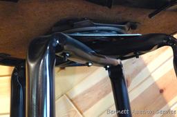 Steel framed swiveling bar stool is 43" tall. Nice and sturdy, vinyl in good condition.