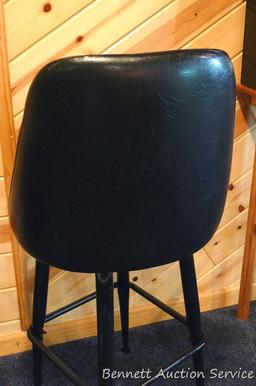 Steel framed swiveling bar stool is 43" tall. Nice and sturdy, vinyl in good condition.