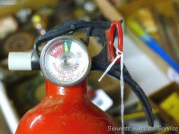 Kiddie dry chemical BC fire extinguisher. No mounting bracket. Gauge shows charged. 14" tall.