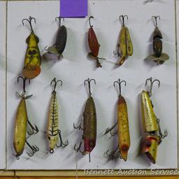 Old fishing lures, some with glass eyes. Longest body is 5".