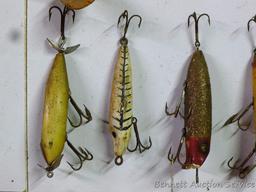 Old fishing lures, some with glass eyes. Longest body is 5".