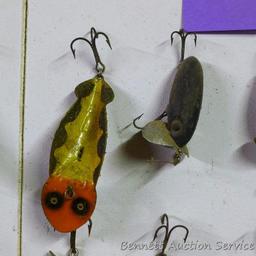 Old fishing lures, some with glass eyes. Longest body is 5".