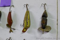 Old fishing lures, some with glass eyes. Longest body is 5".