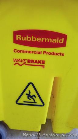 Rubbermaid commercial mop bucket with wringer includes mop and extra NIP mop head. Bucket is 16" x