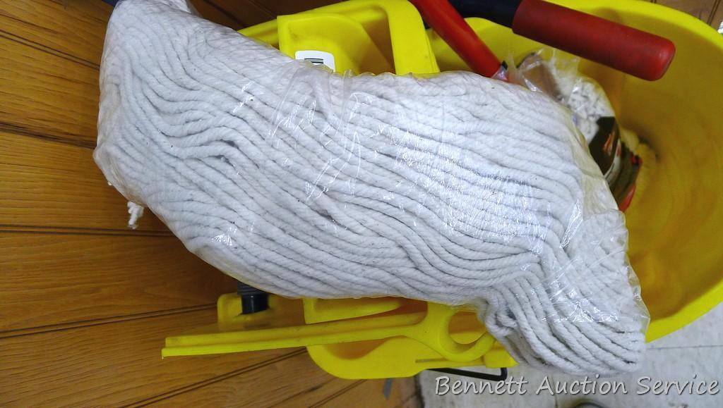 Rubbermaid commercial mop bucket with wringer includes mop and extra NIP mop head. Bucket is 16" x